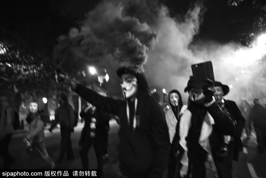 英國：蓋伊·?？怂怪暝俣热紵“偃f面具游行在倫敦舉行